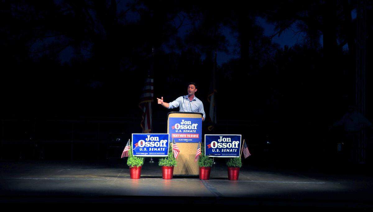Jon Ossoff answers questions from the media after a Wednesday evening rally at the Columbus Civic Center in Columbus, Georgia.