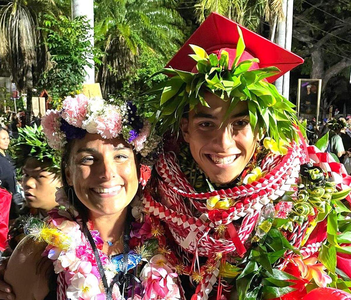 Columbus High School and Columbus State University graduate Jackie Ellis, left, a biology and marine science teacher at Lahainaluna High School on the Hawaiian island of Maui, poses with one of her students, Joa Navarro, after the lei ceremony that celebrated his graduation.
