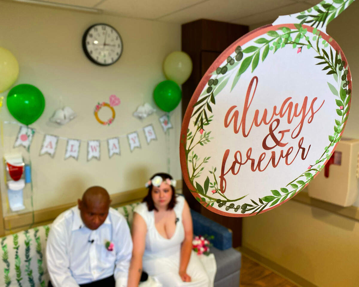 Alexander Santos and his wife Heather answer questions from the media after the couple was married at Piedmont Columbus Regional’s Midtown Campus Wednesday afternoon. 07/20/2023