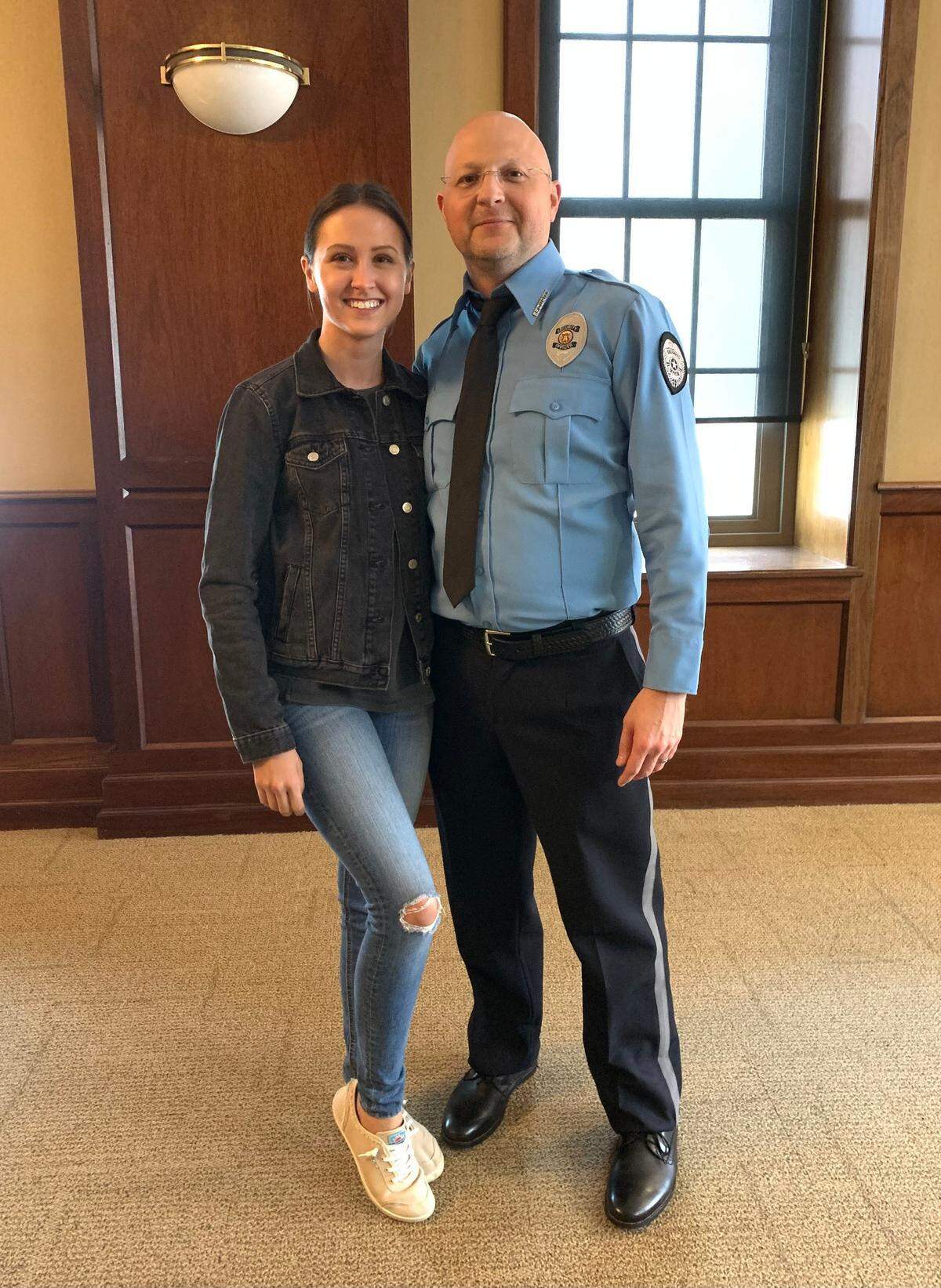 Columbus couple Alex and Clint Tyra pose during a break in the June 2022 filming of the movie “Cash Out” in the Synovus Bank branch in downtown Columbus. Alex was cast as a bank hostage and as a stand-in for Kristin Davis. Clint was cast as a bank security guard and a utility stand-in, mostly for Lukas Haas, Quavo and Swen Timmel. A stand-in is a person who substitutes for a principal actor during rehearsals, camera blocking or lighting setups.