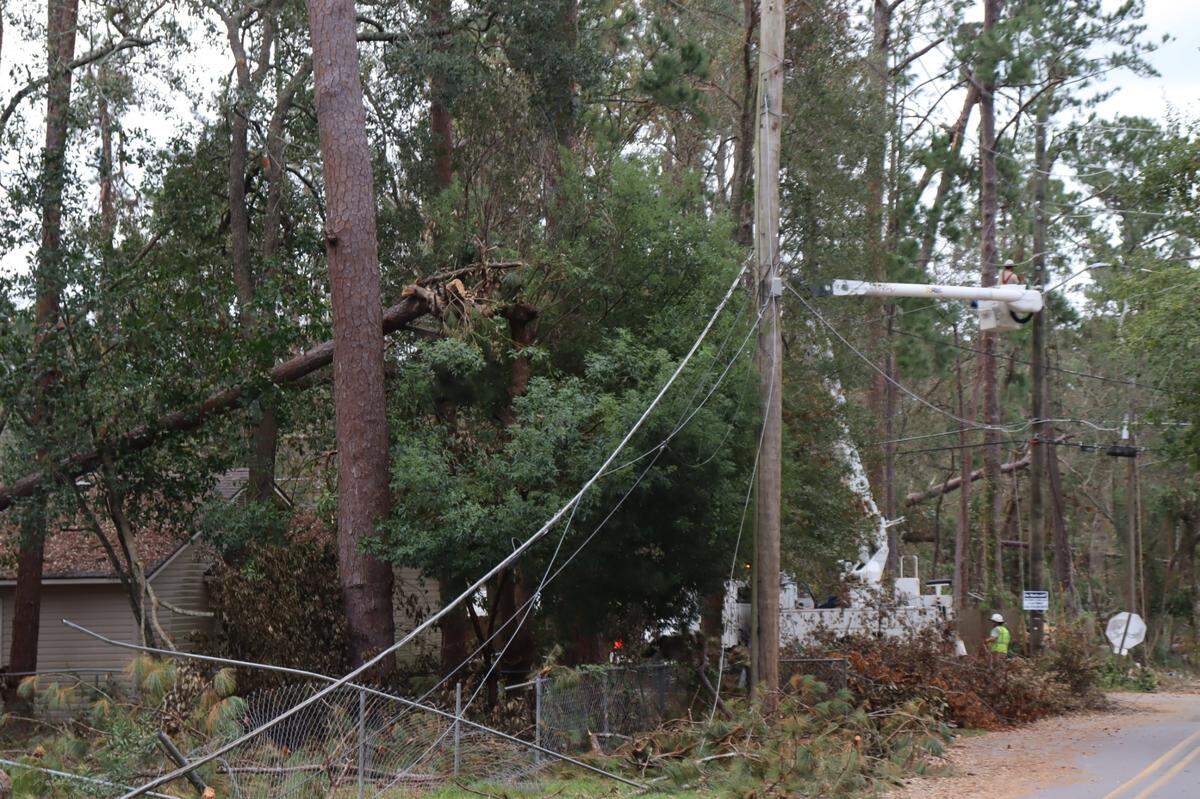 Electric transmission line collapsed from Hurricane Helene damage in Valdosta, Georgia. Workers work to repair seven days after the storm blew through the area. Oct. 4, 2024