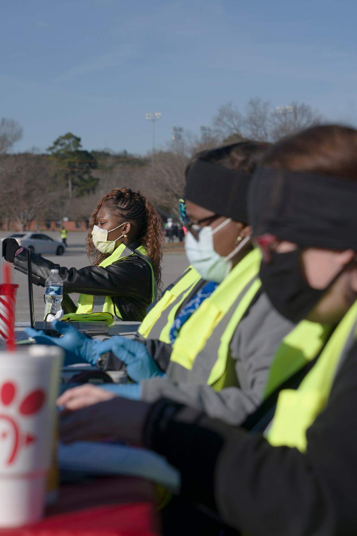 Department of Public Health staff work at the community vaccine site at the Civic Center in Columbus, Ga. on Saturday, Jan. 23, 2021.