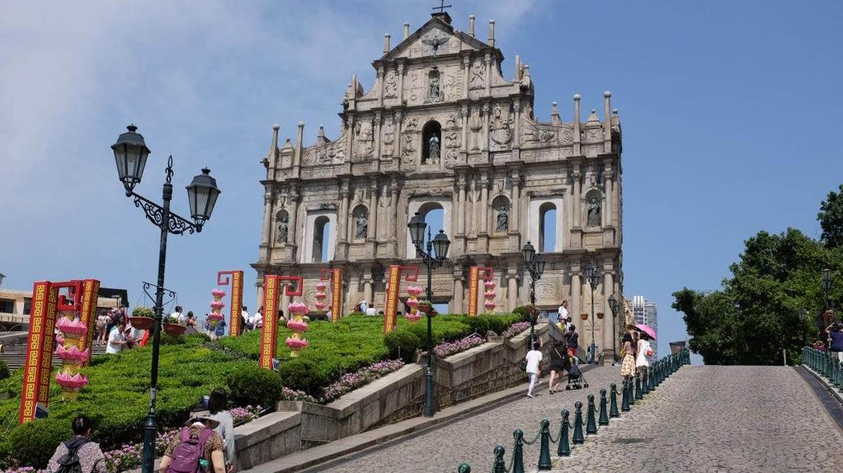 Visitors approach the façade of Sao Paulo, the most-visited of UNESCO World Heritage sites in Macau.