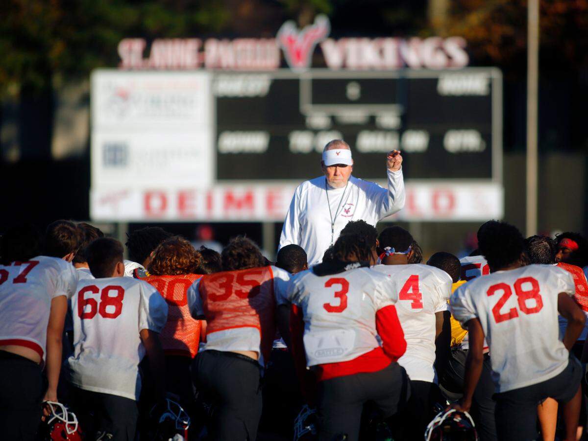 Dwight Jones, head football coach at St. Anne-Pacelli Catholic School in Columbus, Georgia, speaks with the team at practice on Wednesday, Dec. 1, 2022.
