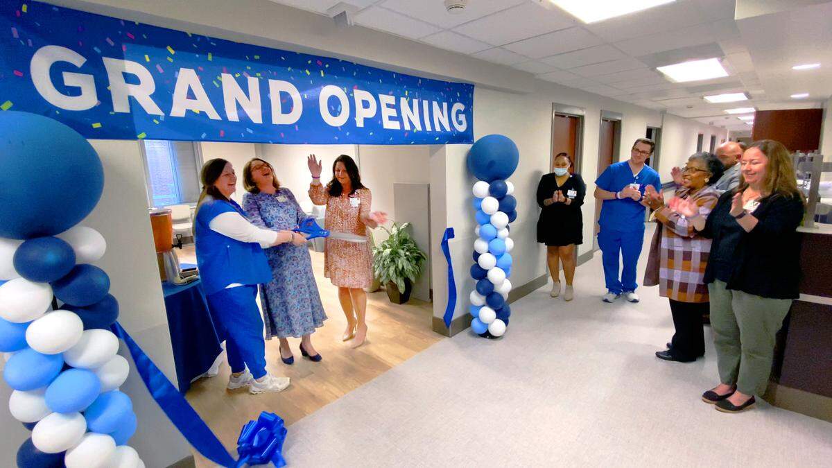 St. Francis-Emory Healthcare celebrated the opening of their new Geriatric Psychiatry Unit with a ribbon cutting and open house Tuesday night. From left, Emilee Roland, the unit’s nurse manager, Dr. Iveta Boyanchek, the unit’s medical director, and Brittany Luther-Jones, executive director of the Bradley Center, cut the ribbon. 10/18/2022