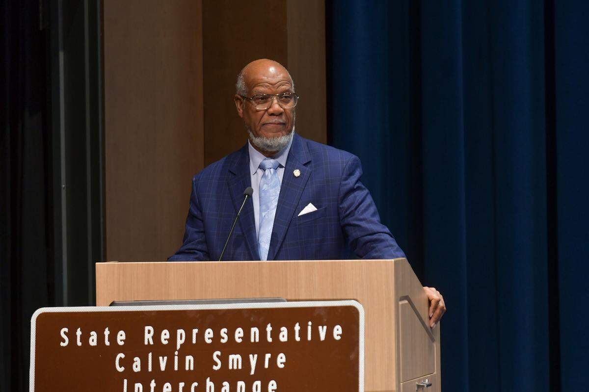 Former state Rep. Calvin Smyre of Columbus speaks in the Rainey-McCullers School of the Arts auditorium Dec. 18, 2024, during the ceremony celebrating the naming of the intersection of I-185 and Macon Road as the Calvin Smyre Interchange.