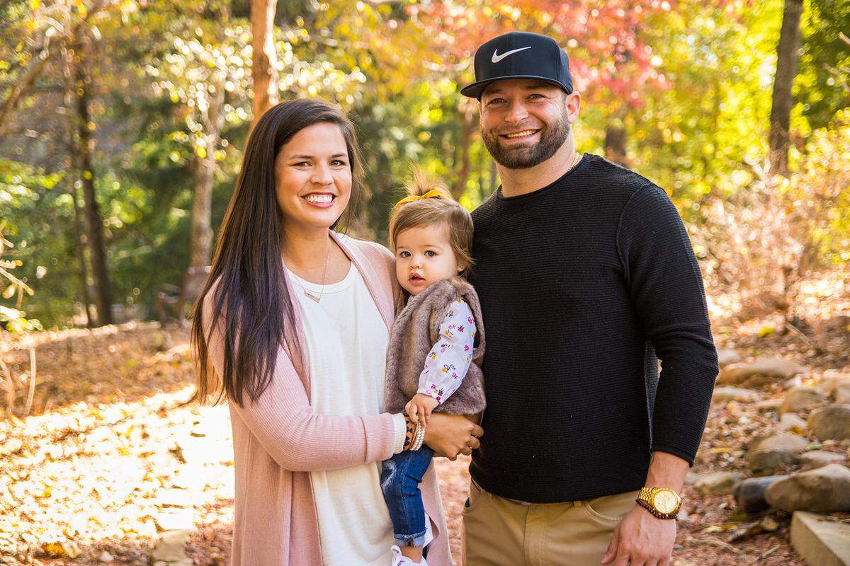Bryan Woodall, right, pictured with wife Christie Woodall and daughter Emory.