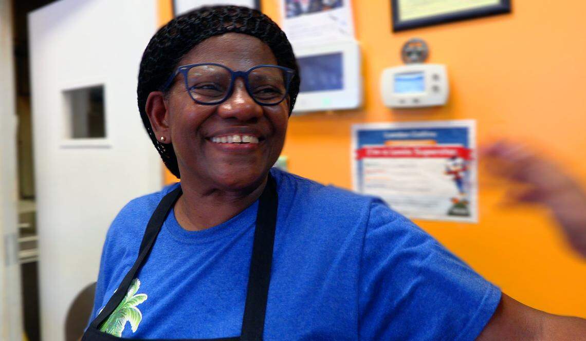 Rose Collins, owner of Rose’s Caribbean Restaurant at 2039 Torch Hill Rd #200, Columbus, Georgia, gets a hug from a lunch customer Thursday morning, August 8, 2019