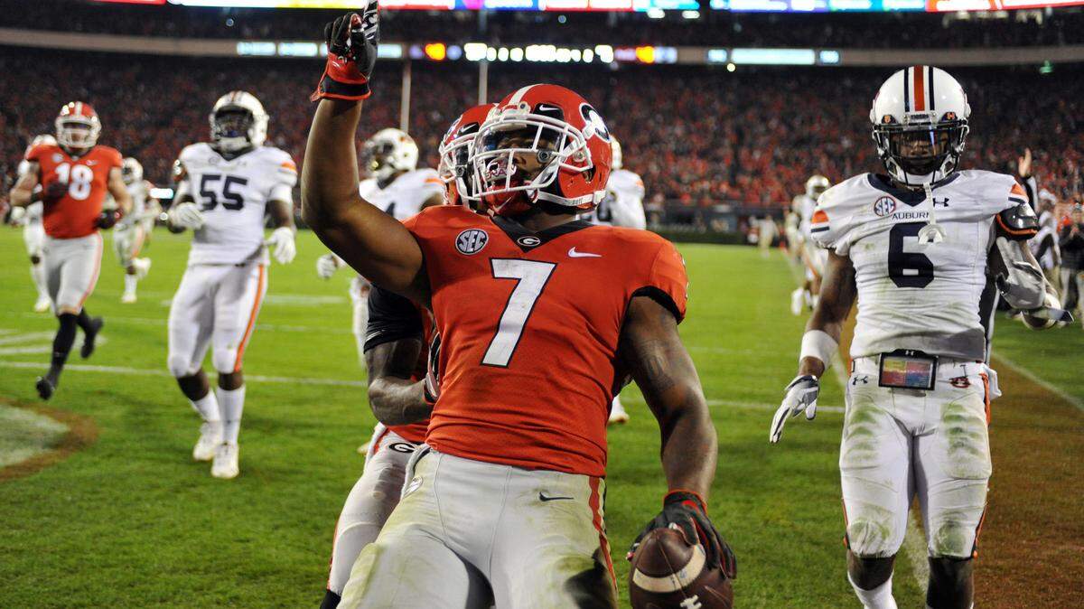 D’Andre Swift (7) celebrates a touchdown run Saturday against Auburn.