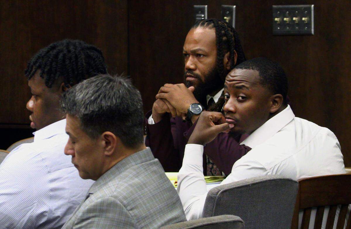 Homer Upshaw, 28, far right, represented by attorney William Kendrick( second from right) glances to the back of the courtroom Monday morning. Also pictured are Rodderick Glanton, 28, left, represented by attorney Allen C. Jones.11/13/2023