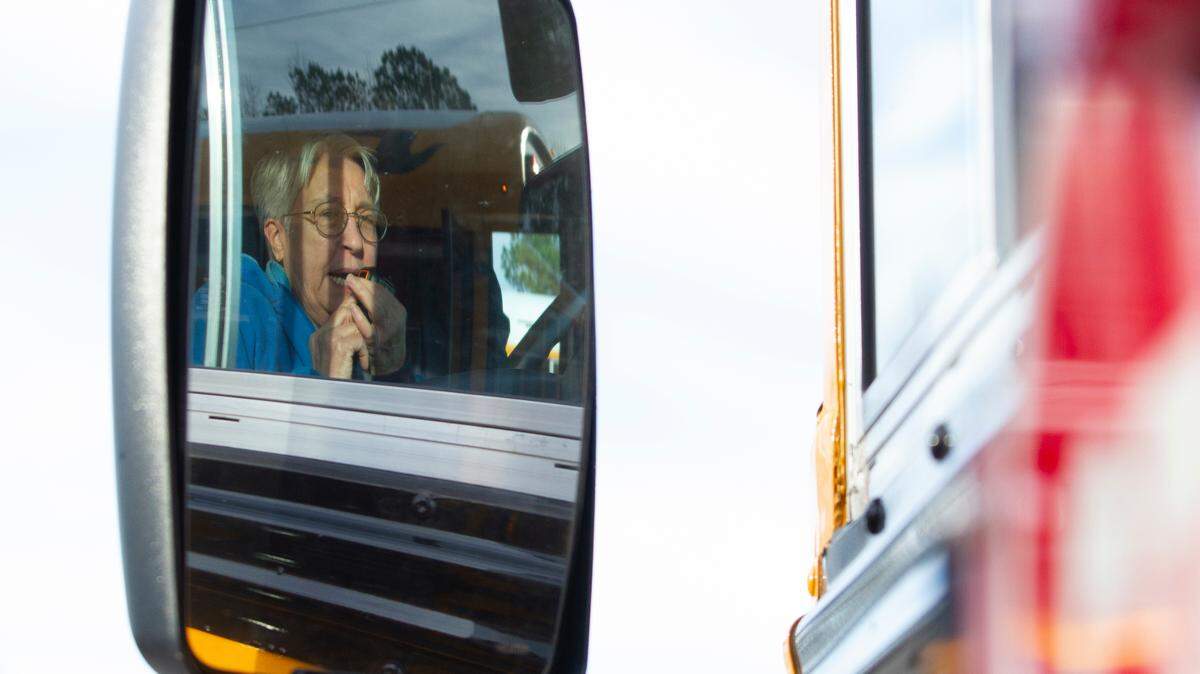 Laurie Devitt, a special education bus driver from Harris County, Georgia, calls into base during training for special education bus evacuation on Thursday, Jan. 19, 2019, at Moultrie Park in Hamilton, Ga. Devitt said that it is important for her to act like she normally does around the students during an emergency so that they would not realize that there was something wrong. Drivers and monitors had two minutes to evacuate their bus to 100 feet away during training.