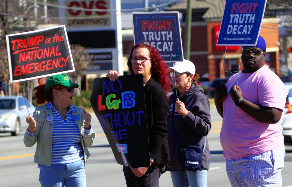 A small group of Columbus residents gathered Friday during the “We Exist” rally and protest. They first greeted passing motorists passing by on Macon Road, then rallied in front of the City Services Center in Columbus, Georgia.