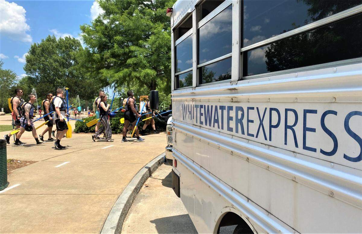 Whitewater Express rafters return downtown after a trip on the city’s 2.5 mile course.