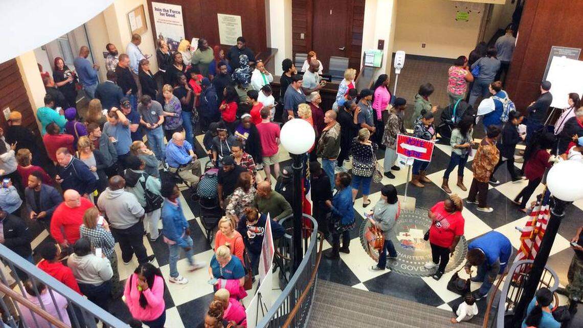 Long lines and broken machines leave hundreds waiting to vote in Georgia
