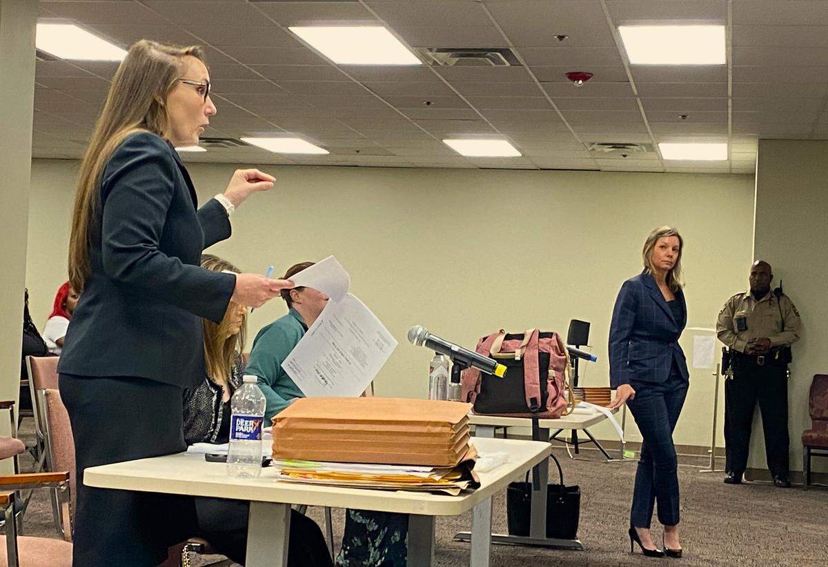 Defense attorney Jennifer Curry, right, listens as prosecutor Meghan Bowen argues in court.