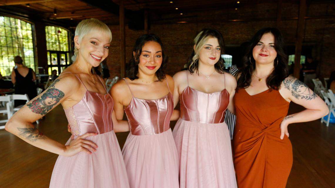 From left, Maddie Tweed, Leila Wheaton, Chelle Leary, and Rebecca Gossett pose for a photograph while waiting to called for a scene after being selected as extras for a scene being filmed Monday at the Bibb Mill Event Center for the movie “Razor’s Edge” in Columbus, Georgia. 07/10/2024