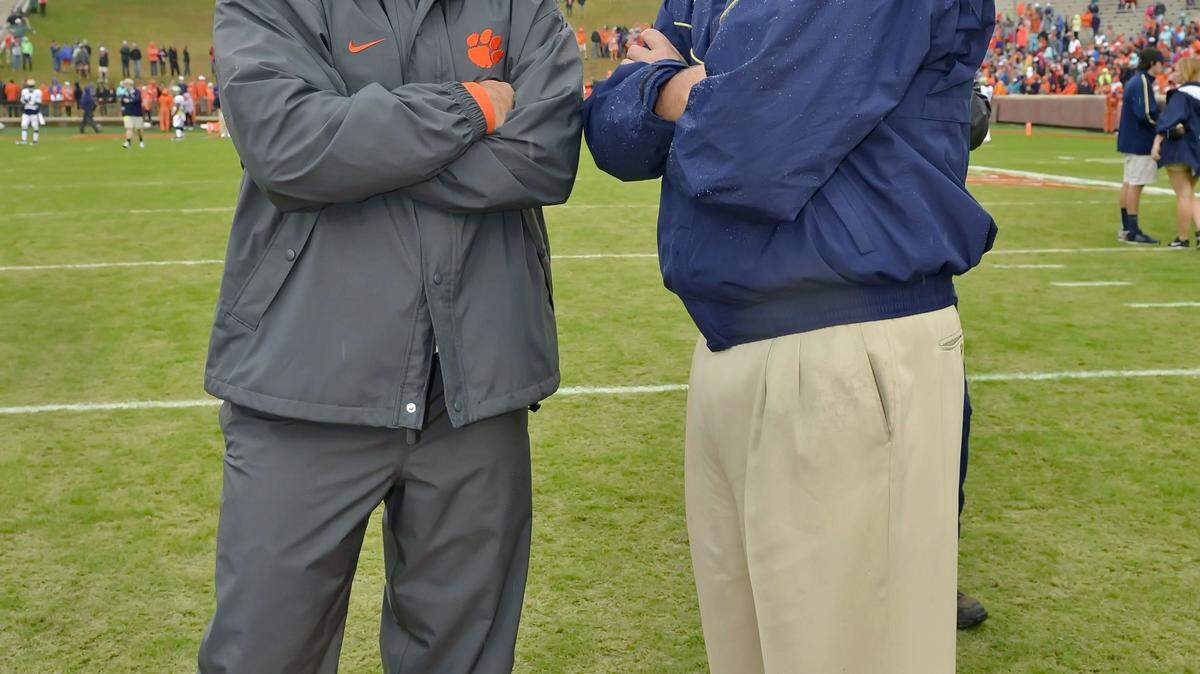 Clemson head coach Dabo Swinney, left, and Georgia Tech coach Paul Johnson talk before the start of an NCAA college football game Saturday, Oct. 10, 2015, in Clemson, S.C. (AP Photo/Richard Shiro)
