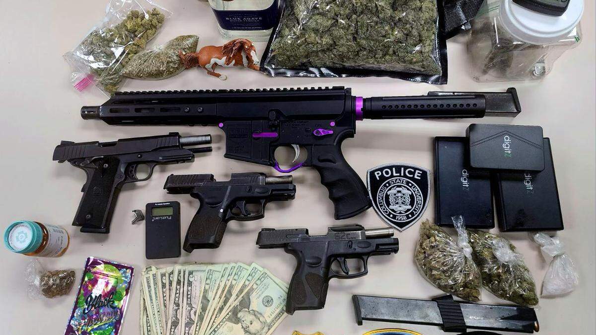 A picture of some of the firearms, drugs and money seized by the Columbus Police Department during Operation “Honey Badger” in June. he press release.