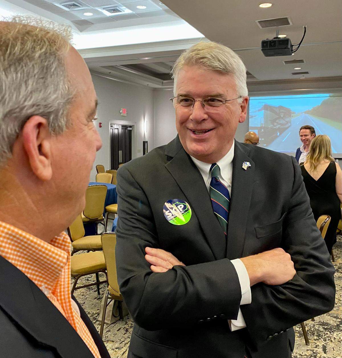 Columbus mayor Skip Henderson speaks with a supporter Tuesday evening at his watch party at the DoubleTree by Hilton in Columbus.