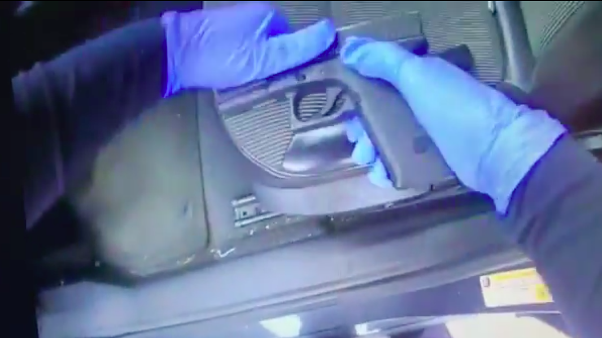A Georgia man was arrested after he placed a baby daughter on the floor of his car over a stolen and loaded gun during a traffic stop, cops say. Drugs and an extended magazine were also found.