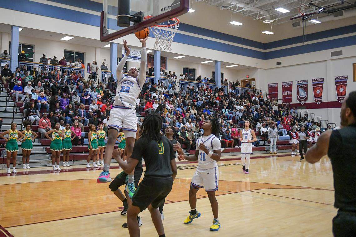Carver’s Tobiaz Tolbert takes it to the hoop against Spencer during the Georgia High School Association Class AA boys basketball state quarterfinals Feb. 26, 2025, at Carver.
