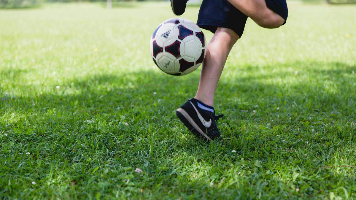 https://www.pexels.com/photo/person-field-playing-school-972513/