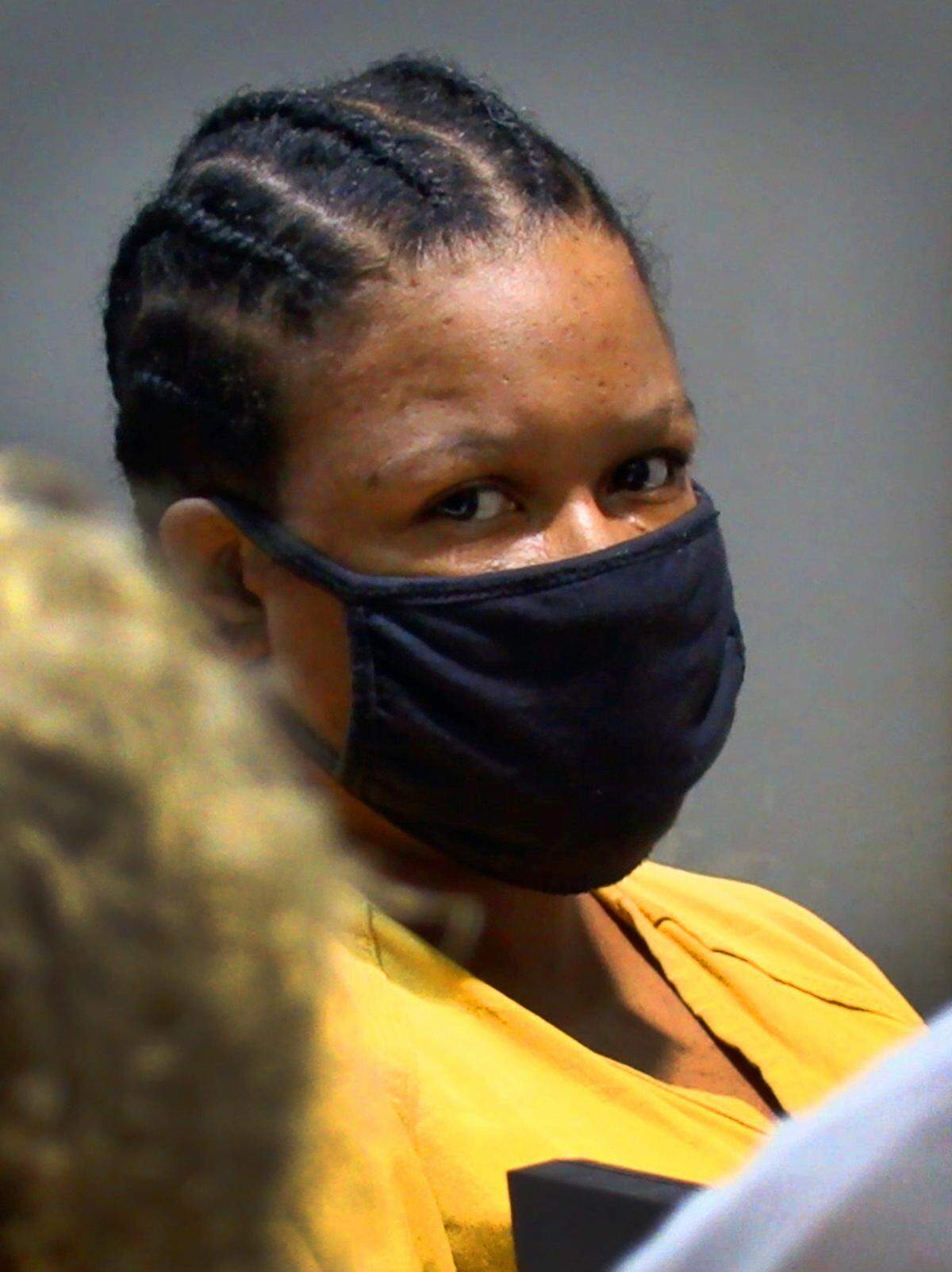 Shanita Evette Wyatt, 40, center, appears for a hearing in Columbus Recorder’s Court Friday morning. She has been charged with murder in the April 2008 death of Paul Hill, 67.