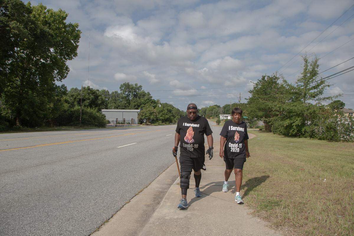 Ed and Cynthia DuBose take a two-mile walk together on Saturday, August 7, 2021, in Columbus, Ga. After recovering from a ventilator and COVID-19, DuBose finds healing in walking, especially with his wife.