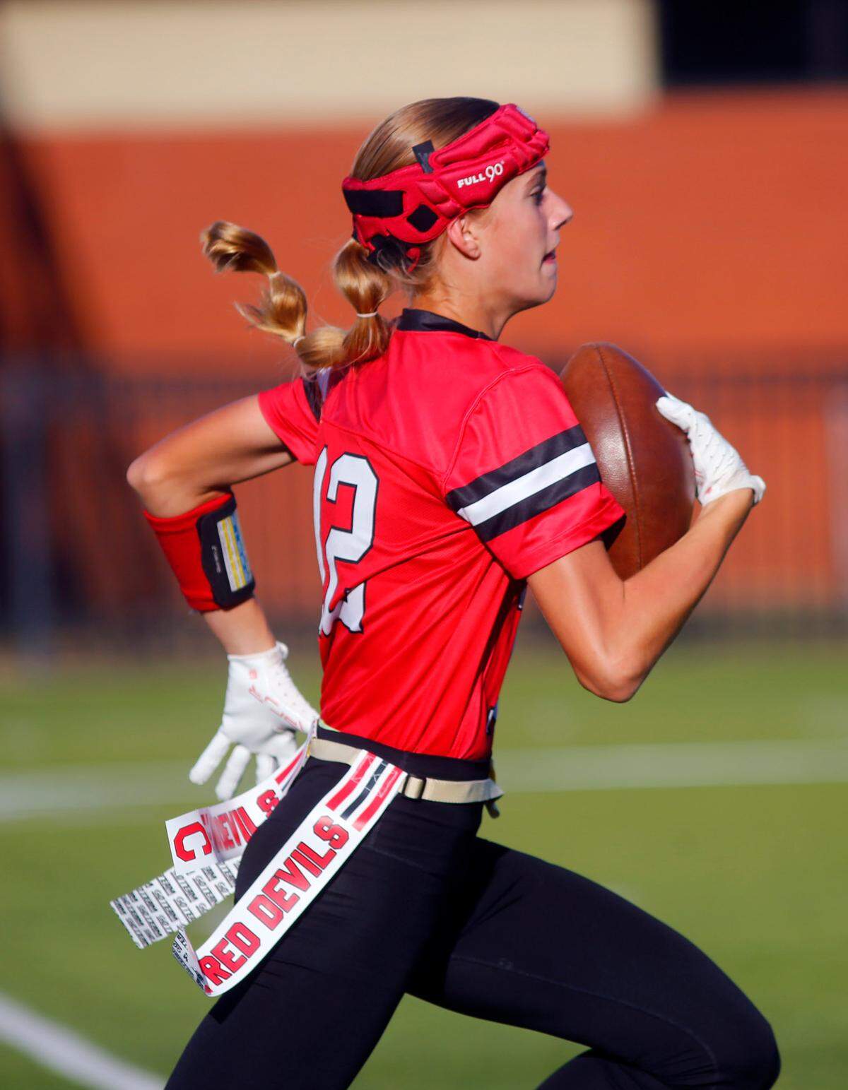 Central’s Savannah Sevier(12) runs the ball into the end zone for a touchdown after catching a passThe varsity flag football team from Central High School in Phenix City, Alabama defeated Brewbaker Tech 48-0 Monday at Garrett-Harrison Stadium.