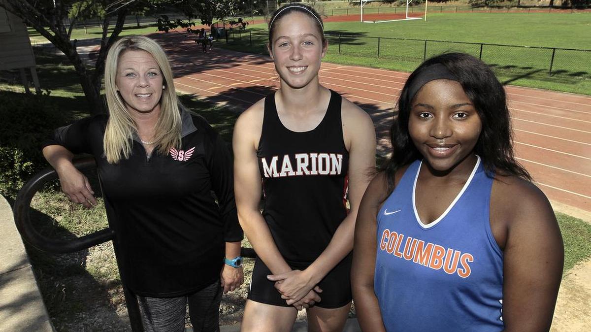 All-Bi-City Girls Track Coach of the Year Cassidy Stecenko of Smiths Station, left, Athletes of the Year Ansley Whitley of Marion County and Tiondra Grant of Columbus High. Not pictured: Athlete of the Year Alonie Sutton of Smiths Station