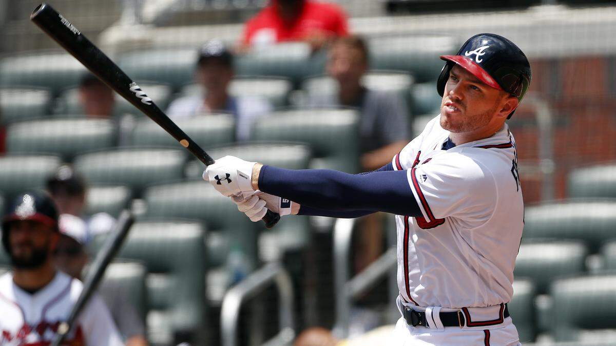 Atlanta Braves first baseman Freddie Freeman (5) follows through as he bats against the Cincinnati Reds during a baseball game Wednesday, June 27, 2018, in Atlanta