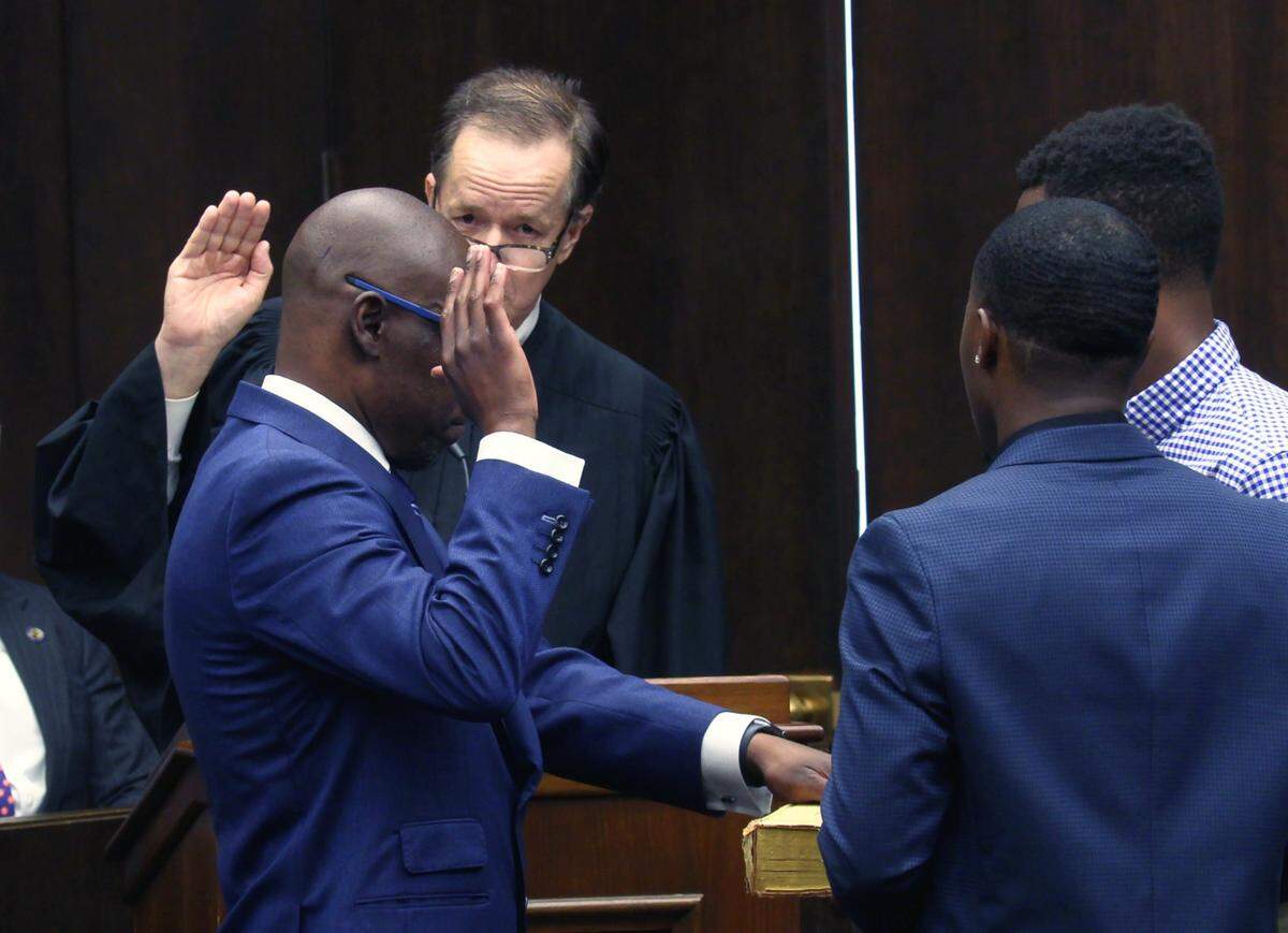 Superior Court Judge Gil McBride, facing camera, swears in Stacey Jackson as the new district attorney for the Chattahoochee Judicial Circuit on Friday afternoon in Columbus, Georgia. 05/20/2022