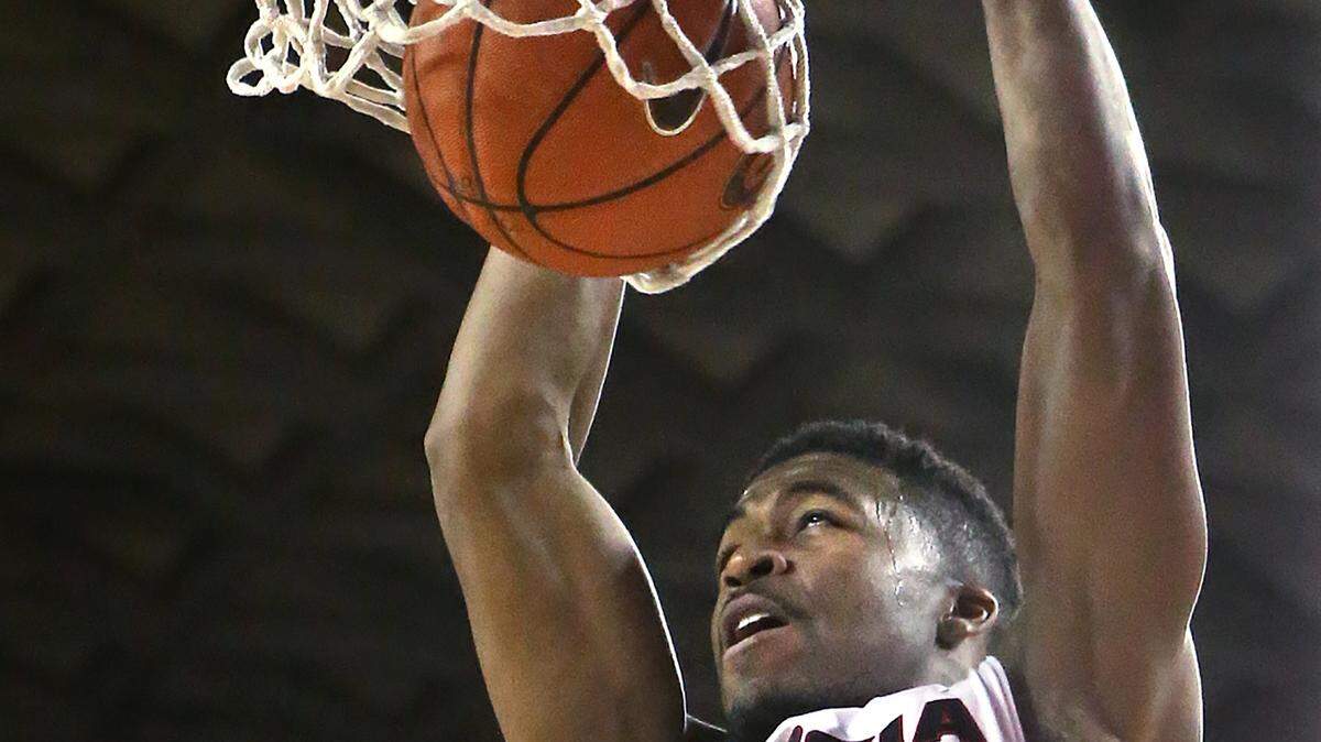CURTIS COMPTON/Atlanta Journal Constitution via APGeorgia guard Kenny Gaines dunks against Tennessee Jan. 13 in Athens, Ga. Georgia won 81-72.