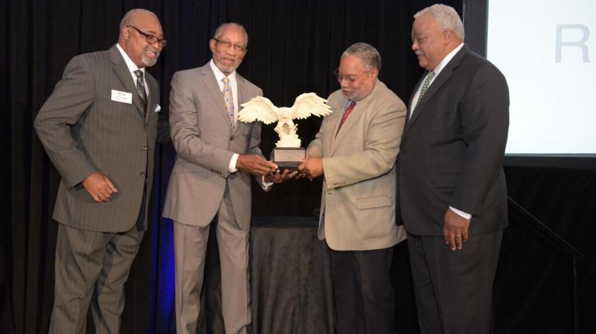 Aflac board representatives Ben Johnson, Bob Wright and and Melvin Stith present Lonnie Bunch, founding director of the Smithsonian National Museum of African American History, with an award at an Aflac reception held in Washington last week during Congressional Black Caucus Foundation weekend.
