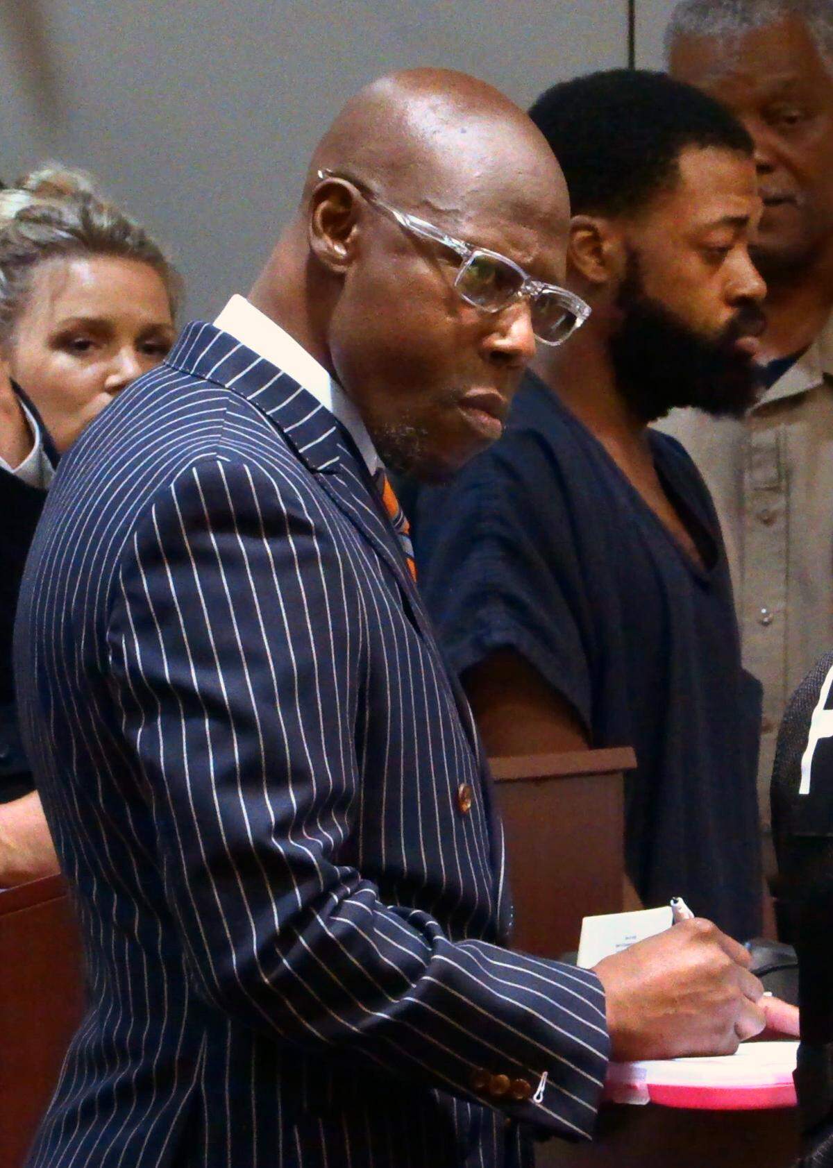 District Attorney Stacey Jackson, front, listens to testimony from Columbus Police Sgt. Danielle Danforth during a Friday morning hearing for Gregory Wharton Jr., 26, right rear, in Columbus Recorder’s Court in Columbus, Georgia. Wharton is charged with murder in the Monday death of 77-year-old Lystra Lewis on Wedel Drive, off Double Churches Road in the Kirkwood subdivision of north Columbus. 07/28/2023