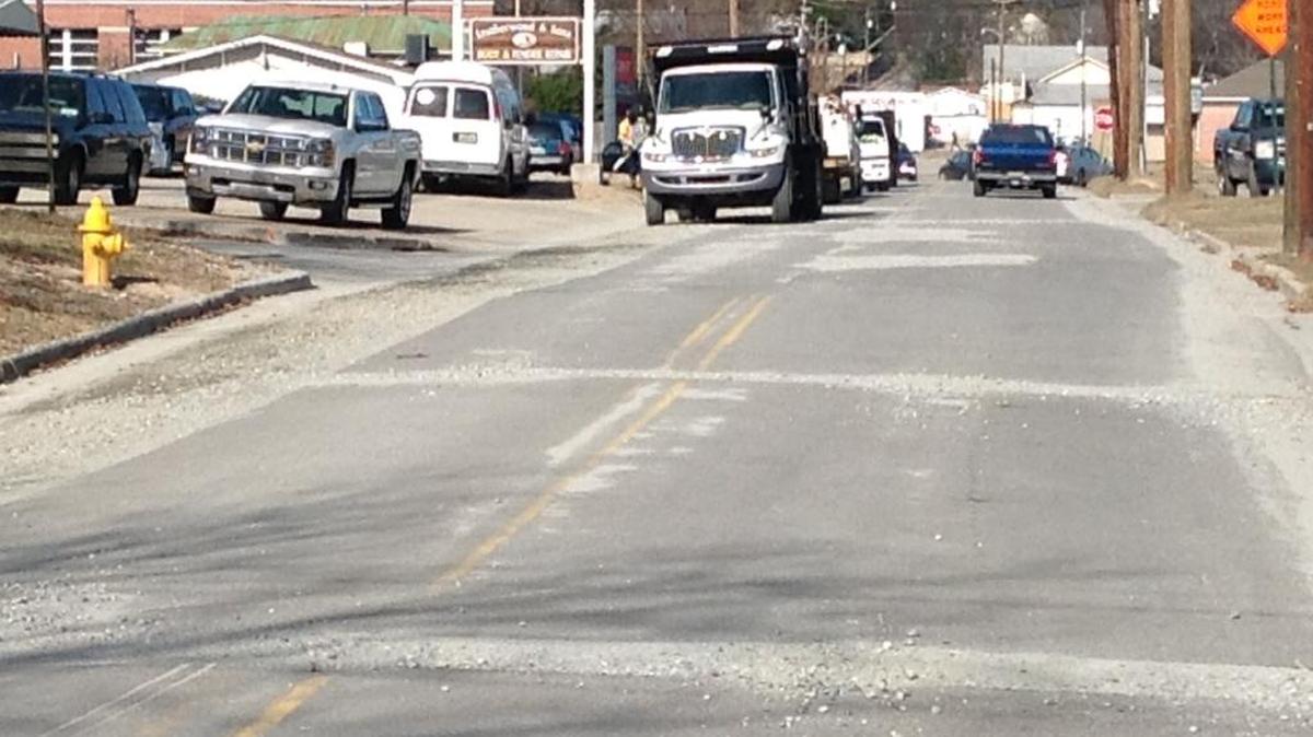Work beneath the street on 10th Avenue is completed, but the bitter cold weather has stalled asphalt paving on the block between 12th and 13th streets.