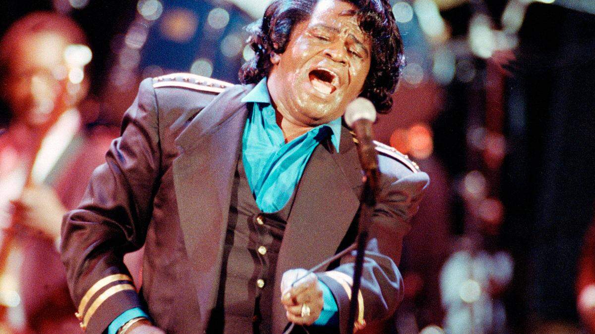 Gospel-soul singer James Brown sings “Living in America” during a concert in Los Angeles on June 10, 1991. (AP Photo/Kevork Djansezian, File)