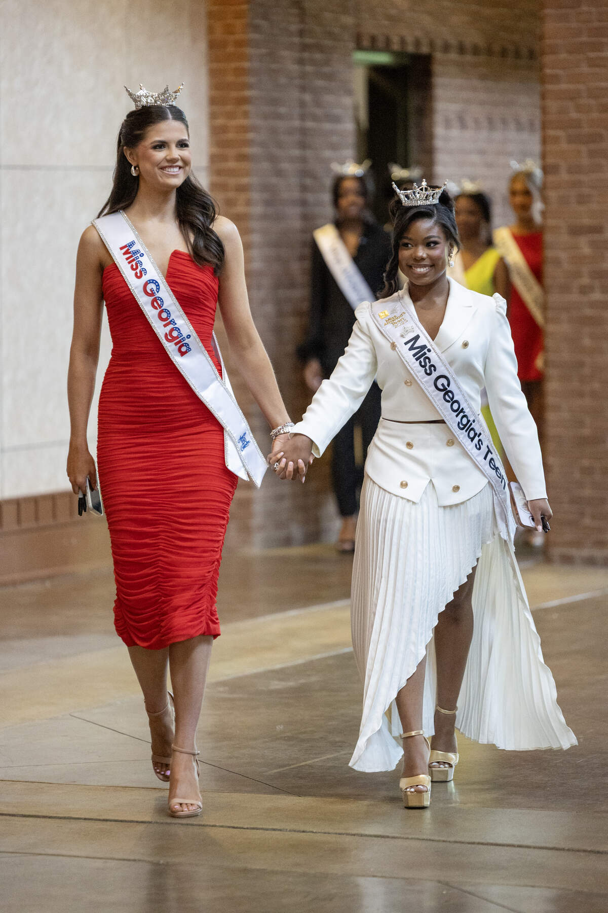 Miss Georgia 2025 Audrey Kittila, left, and Miss Georgia’s Teen 2025 Reagan Moore participate in the Miss Georgia Scholarship Competition “Meet the Crowns” event June 12, 2026, in Columbus.