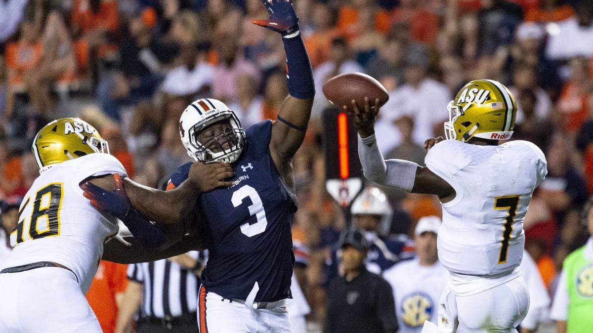 Auburn defensive lineman Marlon Davidson (3) pressures Alabama State quarterback Darryl Pearson, Jr. (7) during the first half of their game Sept. 8 in Auburn, Ala.