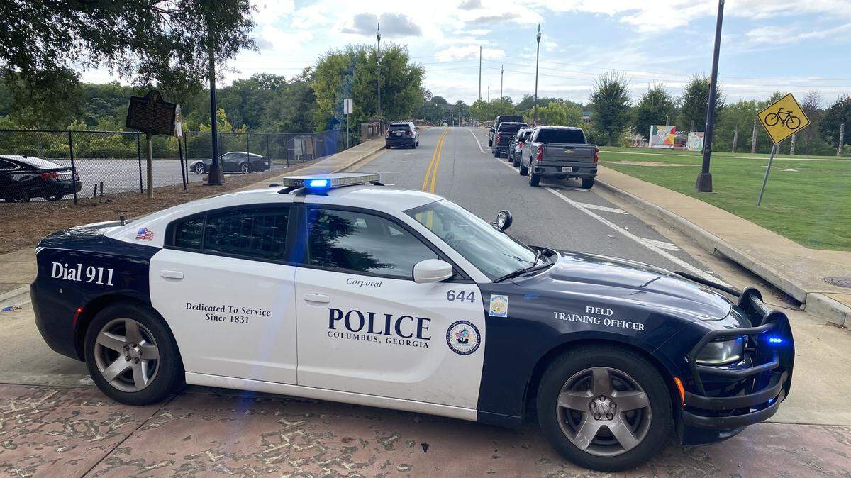 Police block the entrance to the Dillingham Street Bridge on the Columbus side of the Chattahoochee River on Aug. 8, 2025.