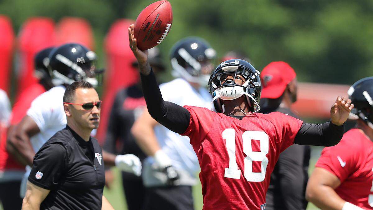 Atlanta Falcons offensive coordinator Steve Sarkisian looks on as first round draft pick wide receiver Calvin Ridley catches a pass during rookie minicamp on May 11 in Flowery Branch, Georgia.