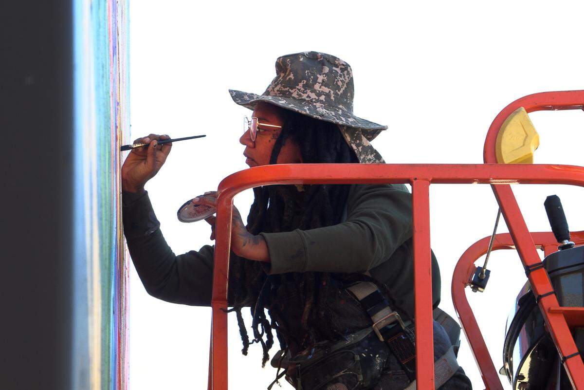 Charity Hamidullah is the muralist creating a new mural at Highside Market in Columbus, Georgia. 10/09/2023