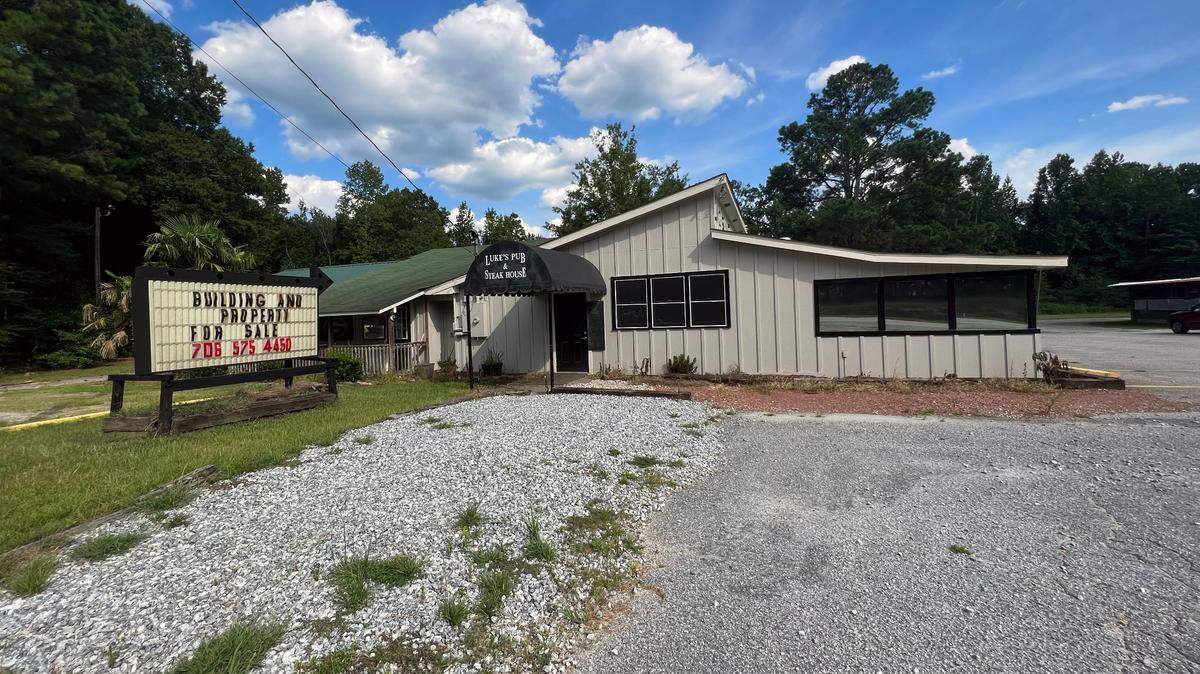 A sign at Luke’s Pub & Steak House, 6080 GA Highway 85, Ellerslie, GA, United States, Georgia, indicates the building and property are for sale. 08/01/2023