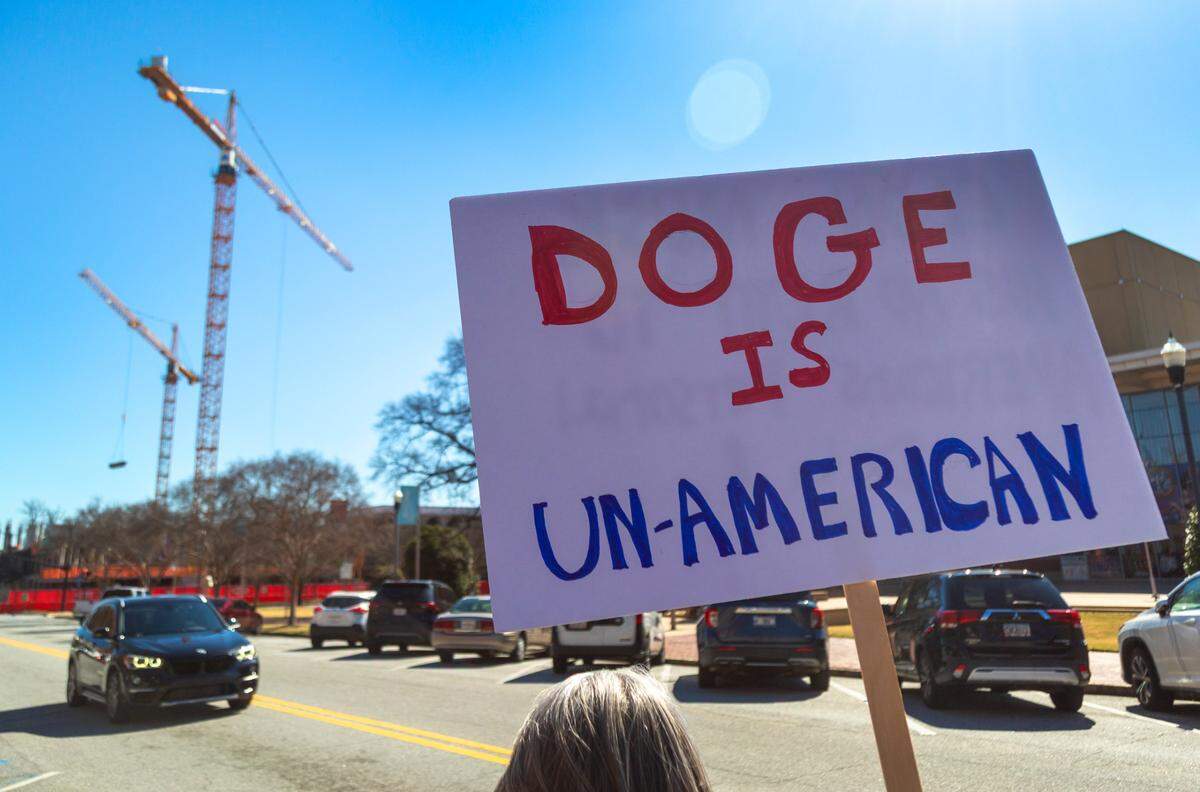 A group of approximately 40-50 people gathered Monday morning at the corner of Broadway and 10th Street in downtown Columbus, Georgia to protest Elon Musk, DOGE, and recent actions by the Trump administration. 02/18/2025