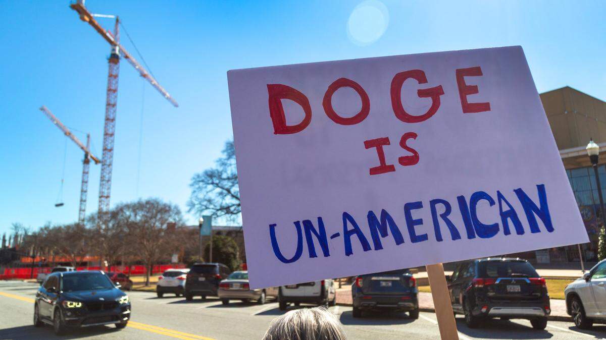 A group of approximately 40-50 people gathered Monday morning at the corner of Broadway and 10th Street in downtown Columbus, Georgia to protest Elon Musk, DOGE, and recent actions by the Trump administration. 02/18/2025