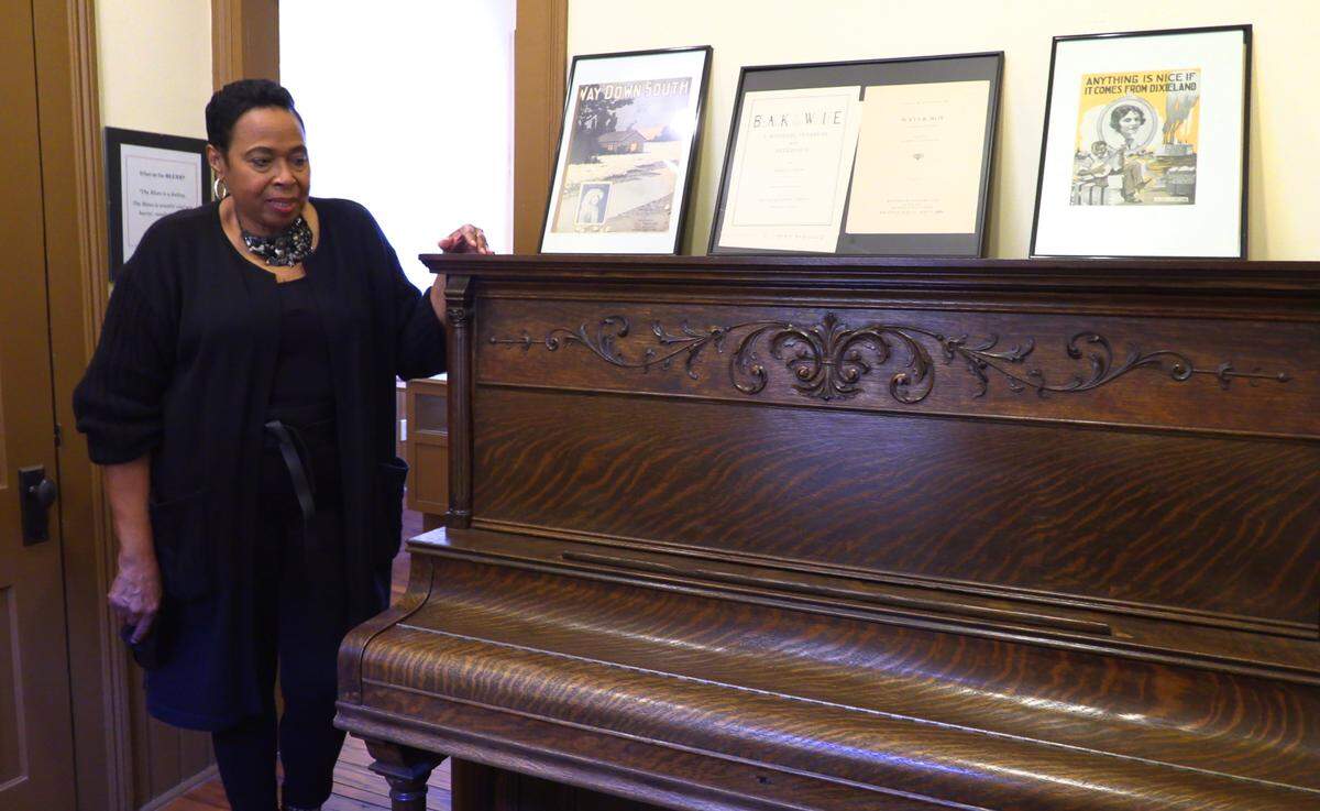 Florene Dawkins, the director of the Gertrude “Ma” Rainey House and Blues Museum in Columbus, Georgia, shows off Rainey’s piano.