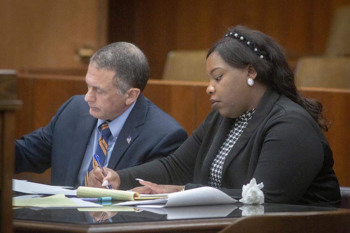 Assistant district attorney Breanna Foster listens to the defense during closing arguments at the Government Center in Columbus, Ga. on Jan. 6, 2022. Foster is the lead attorney in the trial of Rushaun Burton, charged with murder for a 2018 fatal shooting.