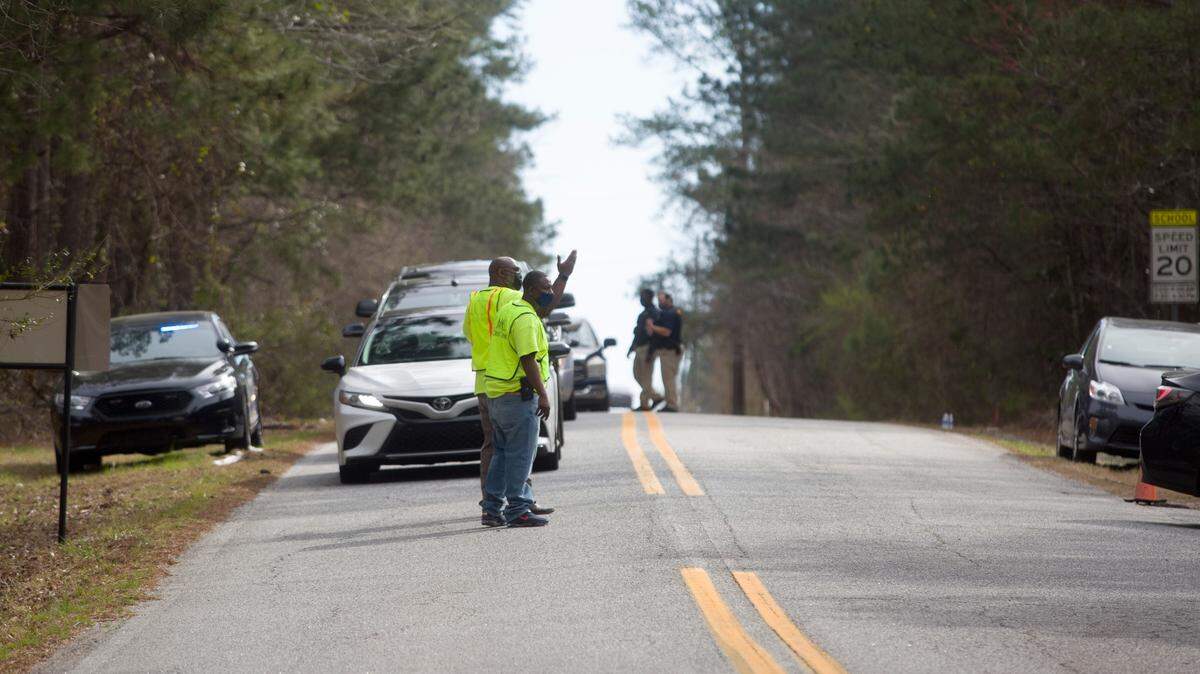 Muscogee County School District employees and local law enforcement help direct traffic to the vaccine clinic for local educators at Kinnett Stadium in Columbus on Wednesday, March 11, 2021.