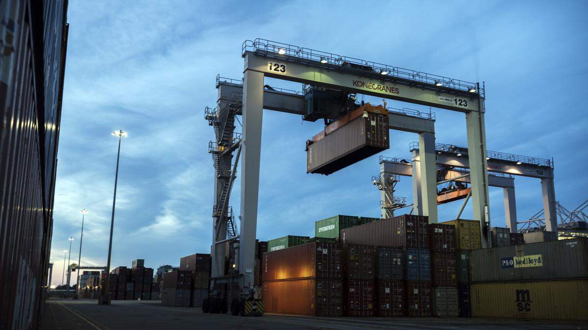 A rubber tire gantry moves 40-foot shipping container in the container yard at the Port of Savannah in Savannah.