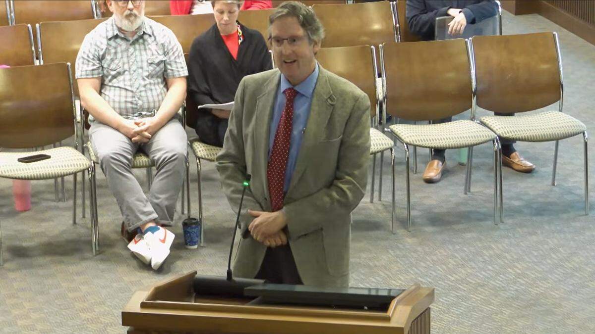 John Van Doorn, who is running for the Columbus Council citywide District 9 seat, speaks against the data center project during the public agenda portion of the council’s meeting on May 12, 2026.